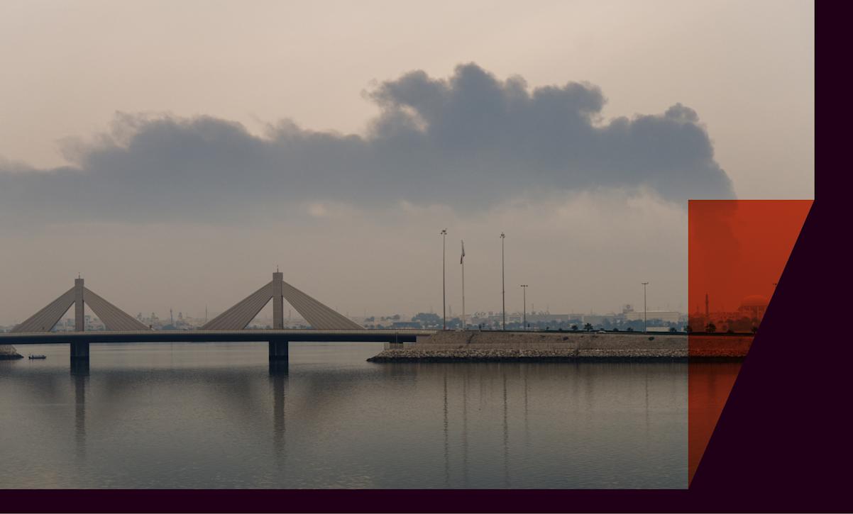 A plume of smoke rises after a reported Iranian strike on fuel tanks in Muharraq