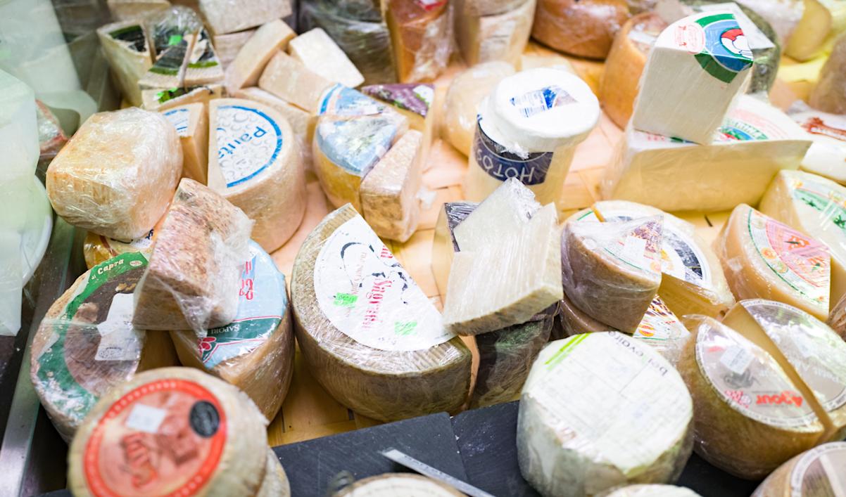Close-up of artisan cheeses on display