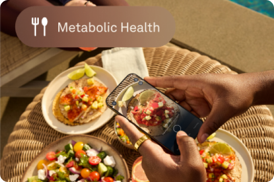 Metabolic Health: Person eating with Oura Ring on