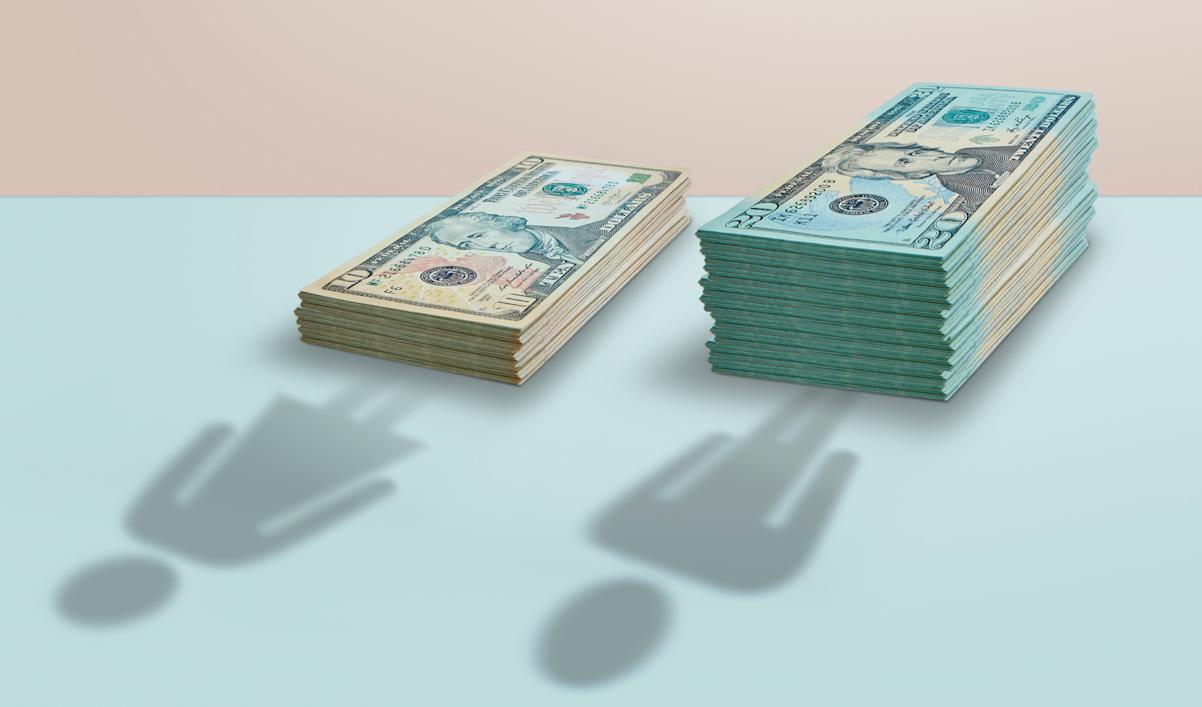 Stacks of cash representing the pay gap 