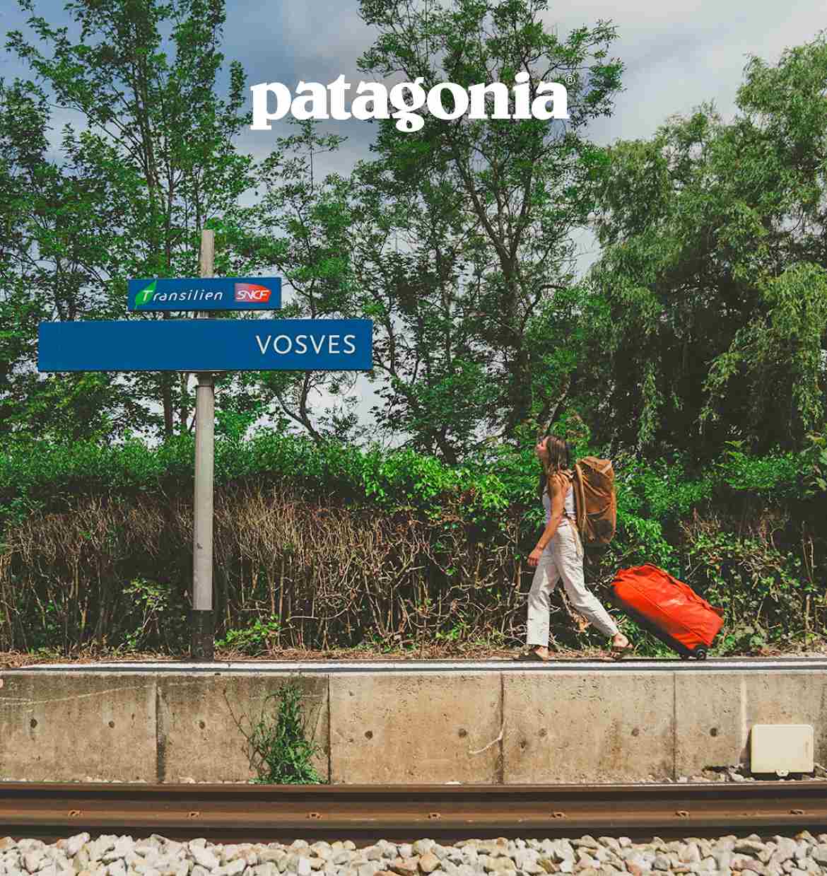 Patagonia. A person rolling a bag to catch a train.