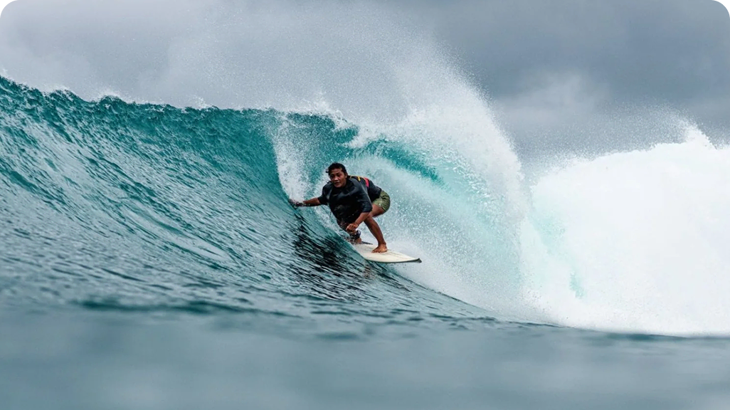 Siska balances a traditional life at home with her family on Siberut with an emerging life in the waves