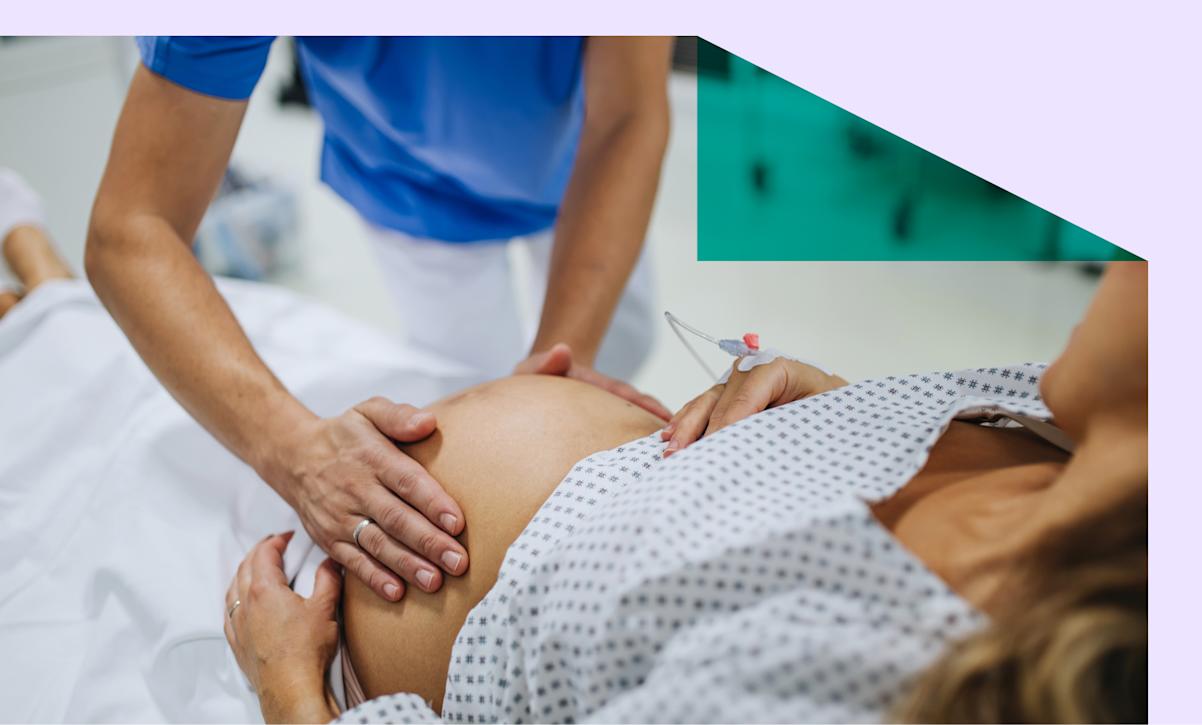 Midwife examining a woman in labor