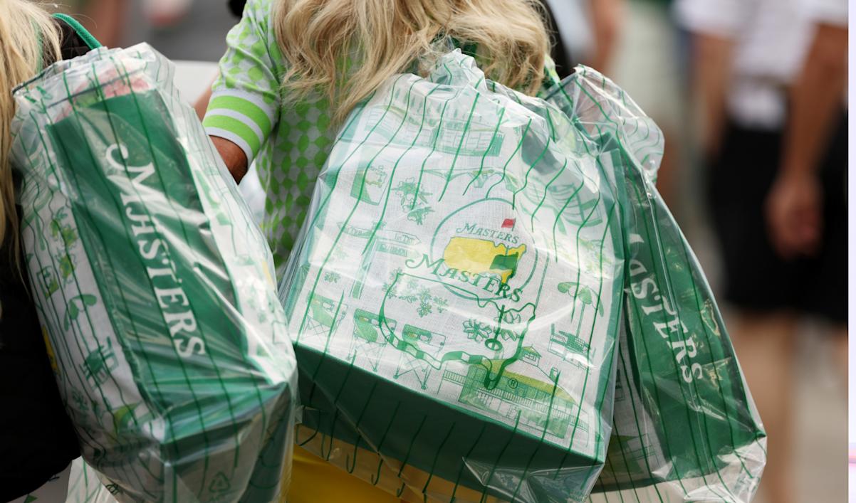 Bags of Masters merchandise are carried during the Drive, Chip and Putt Championship